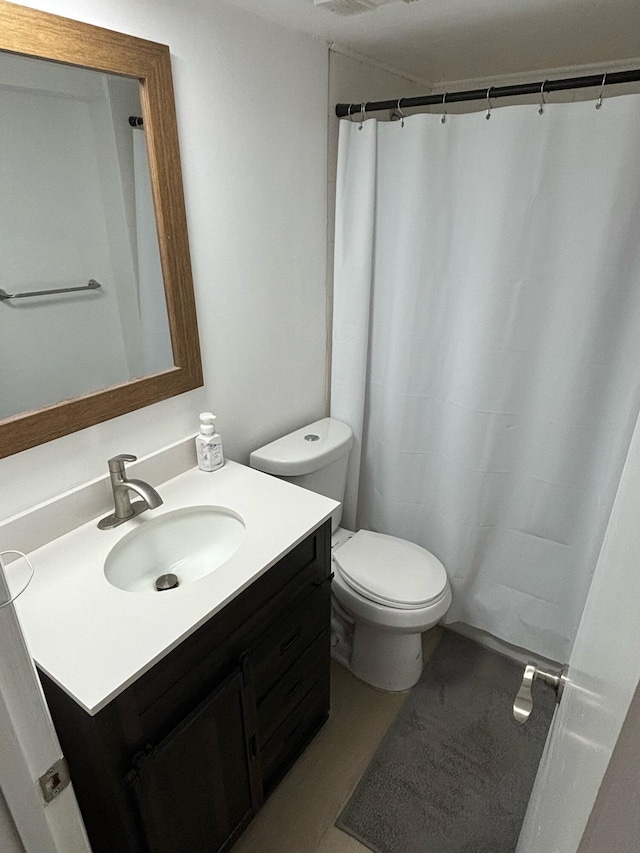 bathroom with hardwood / wood-style flooring, vanity, and toilet