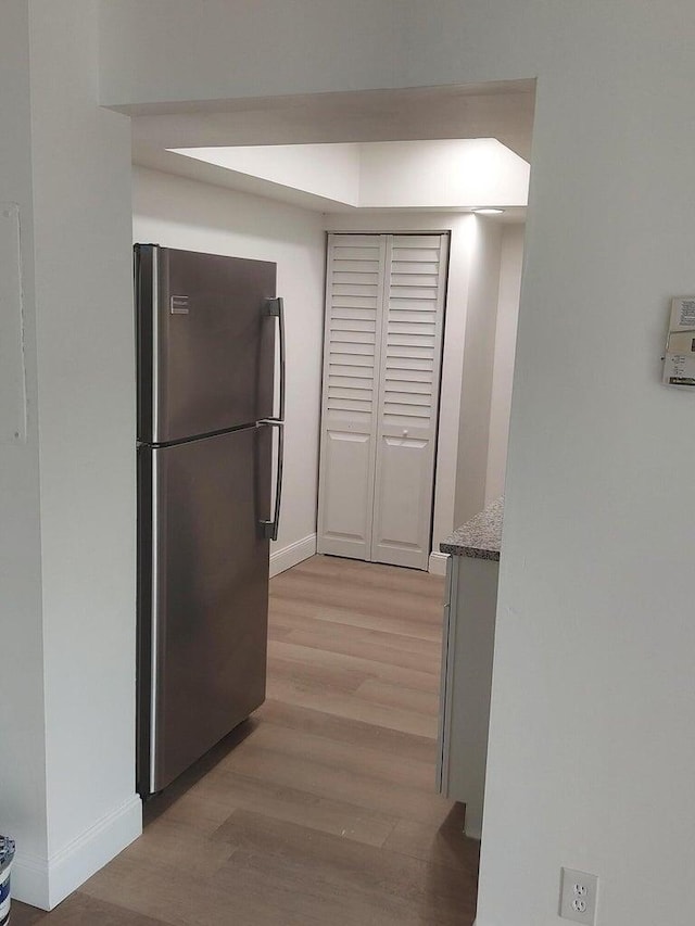 kitchen featuring light hardwood / wood-style floors and stainless steel refrigerator