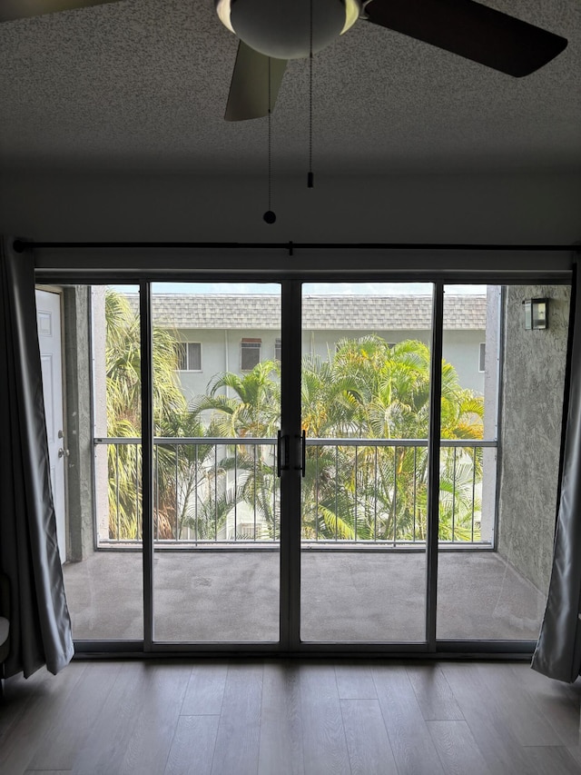 505 Spencer Dr Unit 207, West Palm Beach, FL 33409 - entryway featuring a ceiling fan, healthy amount of natural light, and wood finished floors