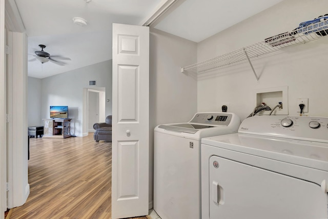 washroom featuring washer and clothes dryer, ceiling fan, and wood-type flooring