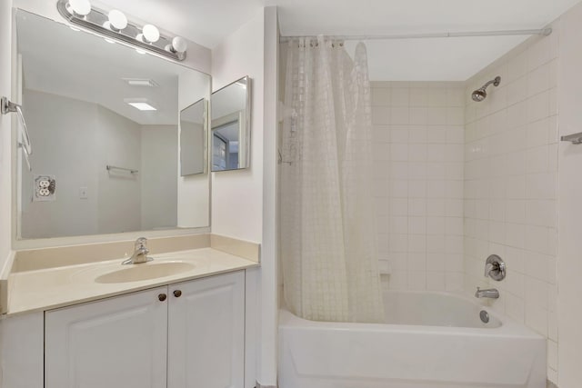 bathroom featuring shower / tub combo with curtain and vanity