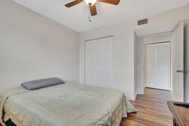 bedroom with ceiling fan and hardwood / wood-style floors