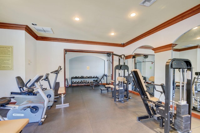 exercise room featuring ornamental molding