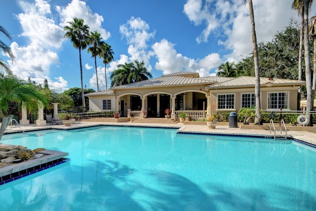 view of swimming pool featuring a patio area