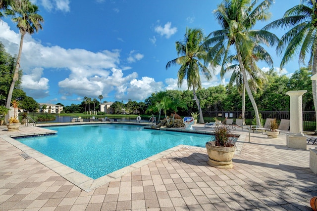 view of swimming pool featuring a patio area