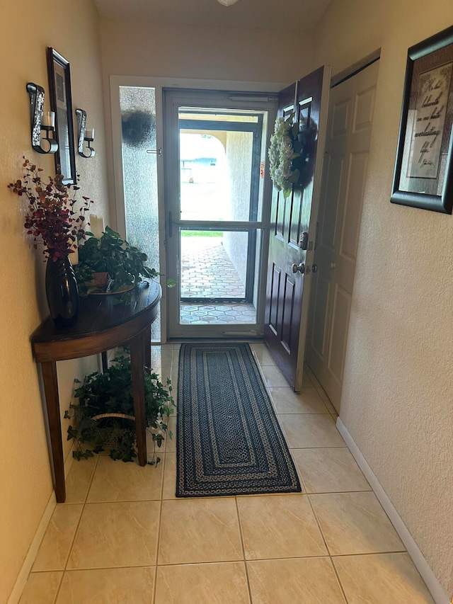 entrance foyer with light tile patterned floors