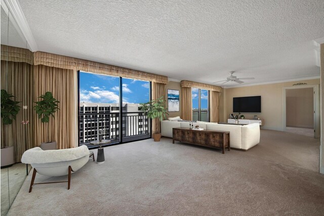 carpeted living room featuring ceiling fan and a textured ceiling