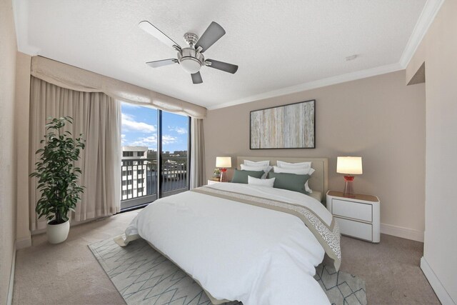 bedroom with access to outside, ceiling fan, a textured ceiling, light colored carpet, and crown molding