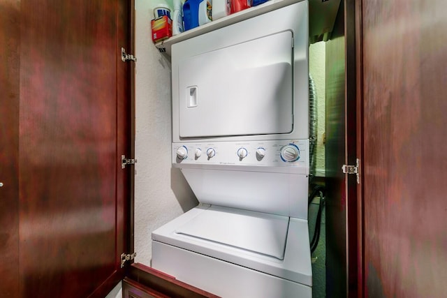 laundry area with stacked washer / drying machine