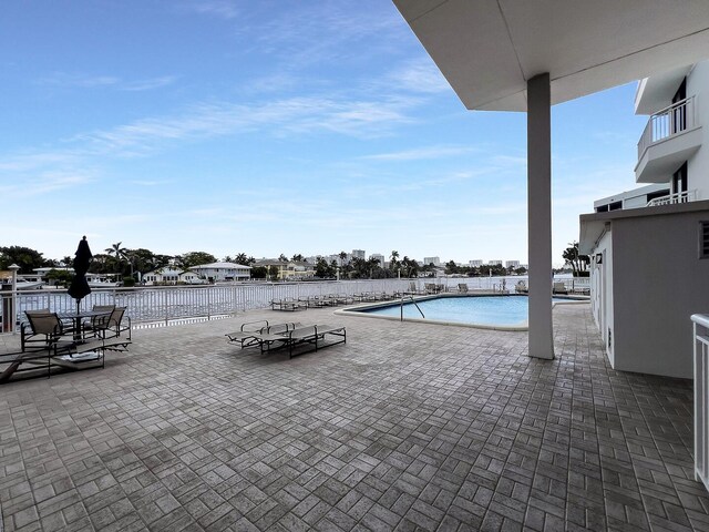 view of swimming pool with a patio