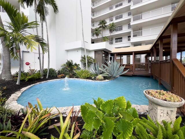 view of pool with pool water feature