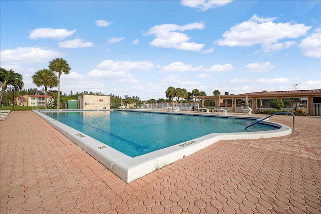 view of swimming pool with a patio area