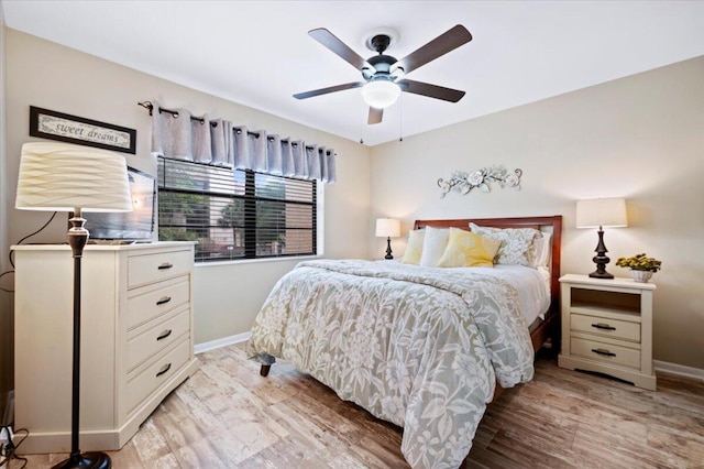 bedroom featuring light hardwood / wood-style floors and ceiling fan