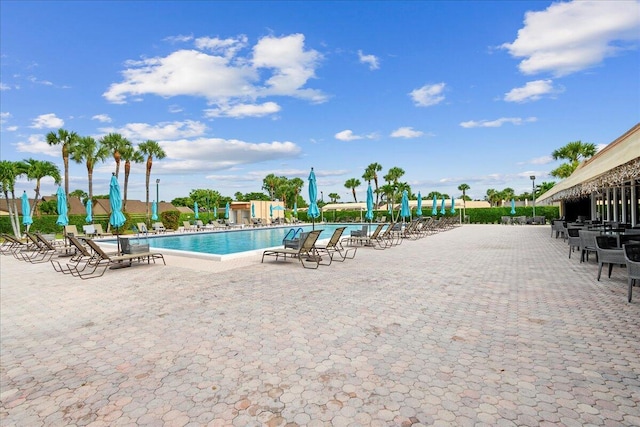 view of swimming pool featuring a patio area