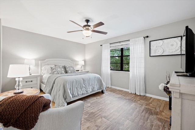 bedroom featuring ceiling fan and hardwood / wood-style floors