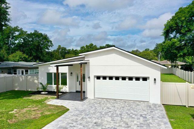 view of front of home featuring a garage and a front yard