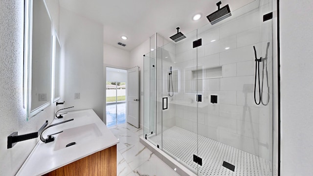 bathroom with walk in shower, tile patterned flooring, and double sink vanity