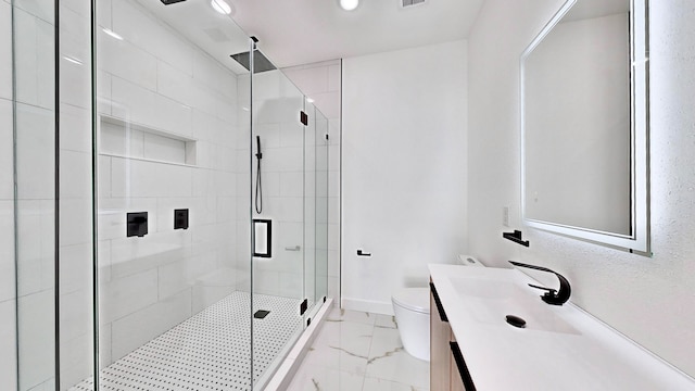 bathroom with tile patterned floors, toilet, vanity, and an enclosed shower