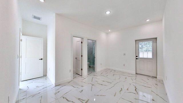 entrance foyer with light tile patterned floors