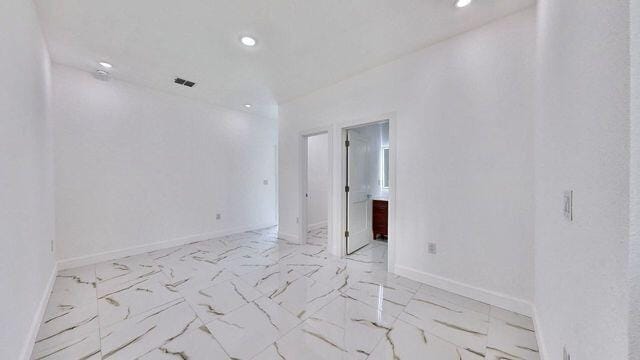 empty room with light tile patterned flooring