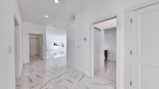 hallway with light tile patterned floors