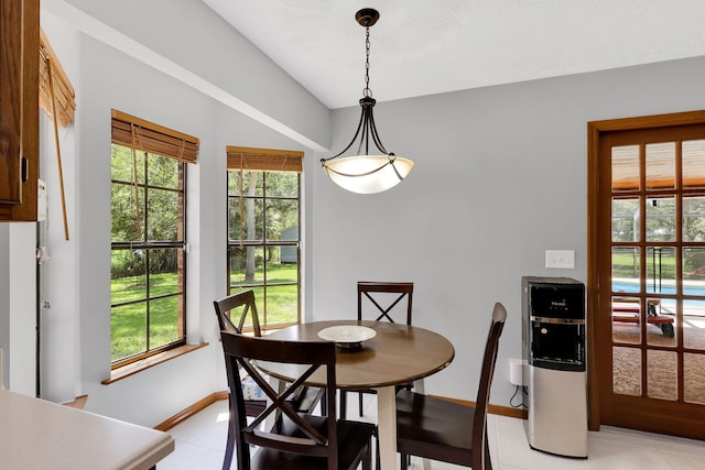 dining area featuring light tile patterned floors