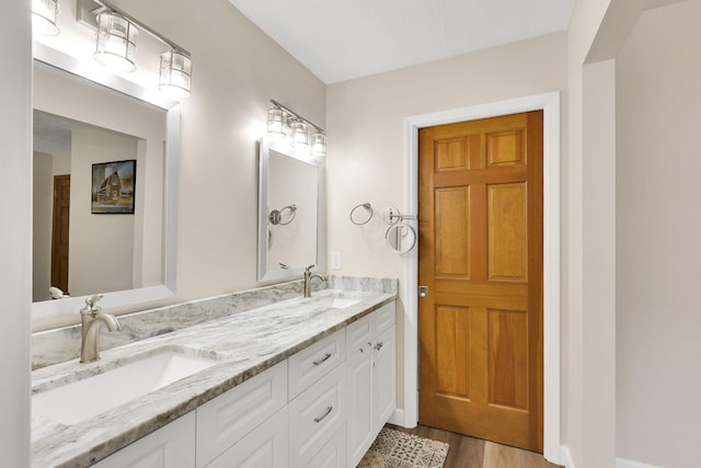 bathroom with hardwood / wood-style flooring and vanity