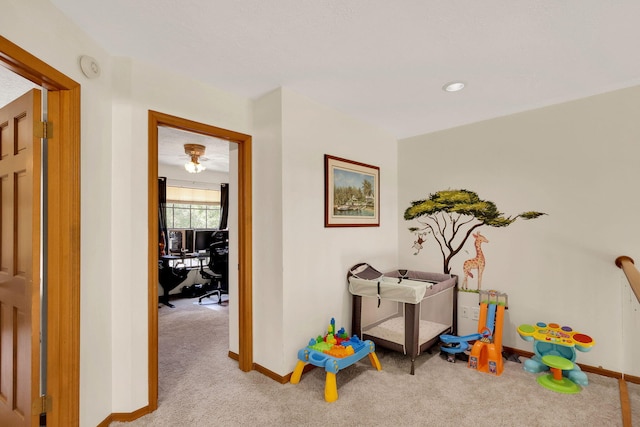 recreation room with light carpet