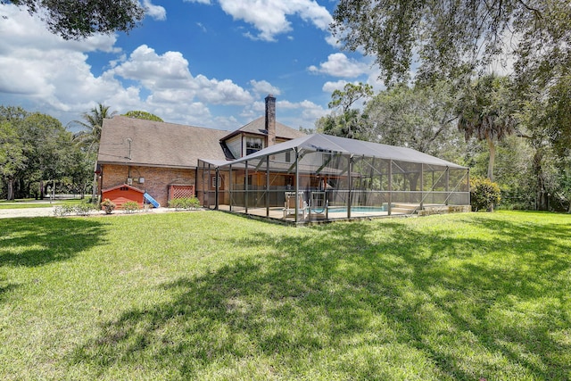 view of yard featuring a patio, a fenced in pool, and glass enclosure