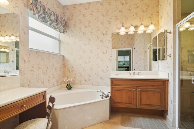 bathroom featuring shower with separate bathtub, tile patterned floors, and vanity