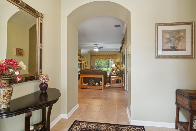 corridor featuring light tile patterned floors