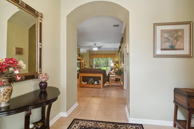 hall with light tile patterned flooring