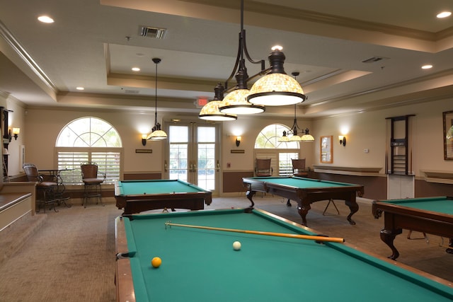 playroom with french doors, billiards, crown molding, a raised ceiling, and dark carpet