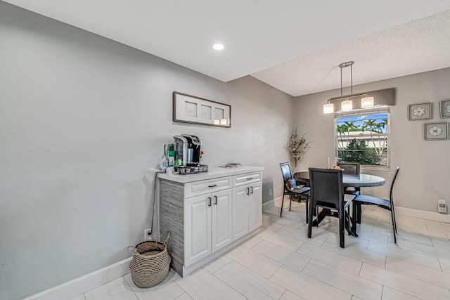 dining area with light tile patterned floors