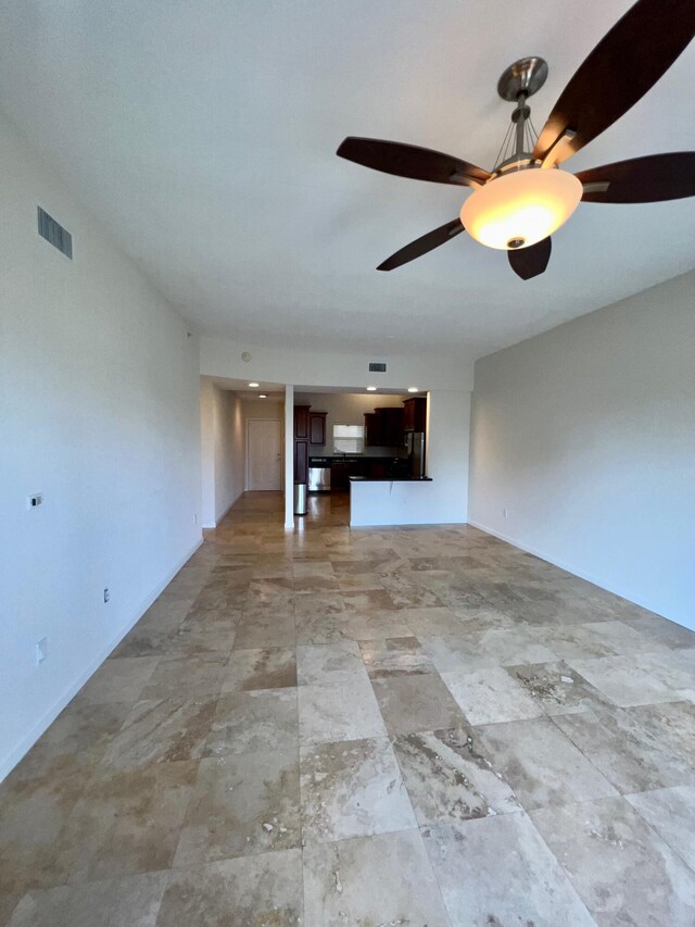 unfurnished living room with light tile patterned floors and ceiling fan