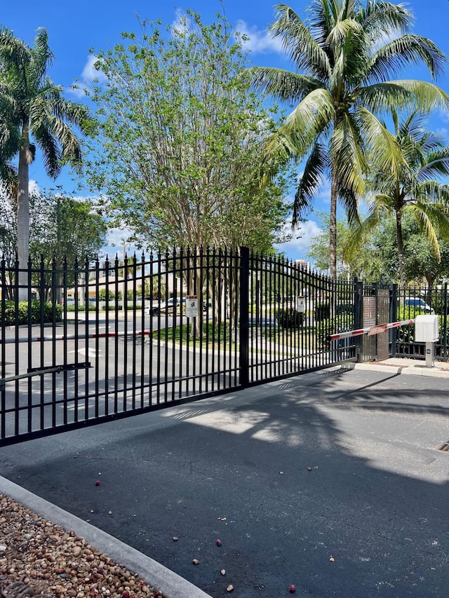 view of gate featuring fence