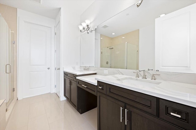 bathroom with tile patterned flooring, vanity, and an enclosed shower