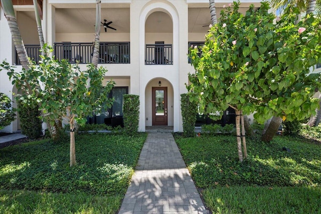 exterior space featuring a balcony and ceiling fan