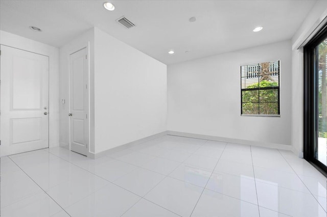 spare room with light tile patterned floors