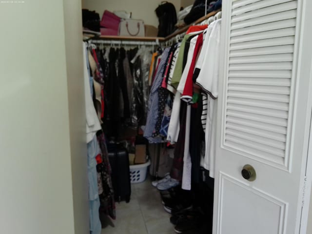 spacious closet featuring tile patterned flooring