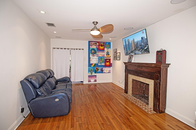 sitting room featuring ceiling fan and hardwood / wood-style floors