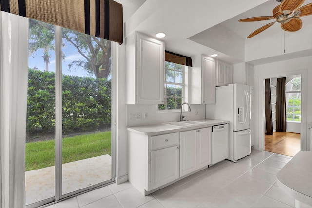 kitchen featuring sink, ceiling fan, light tile patterned floors, and white appliances