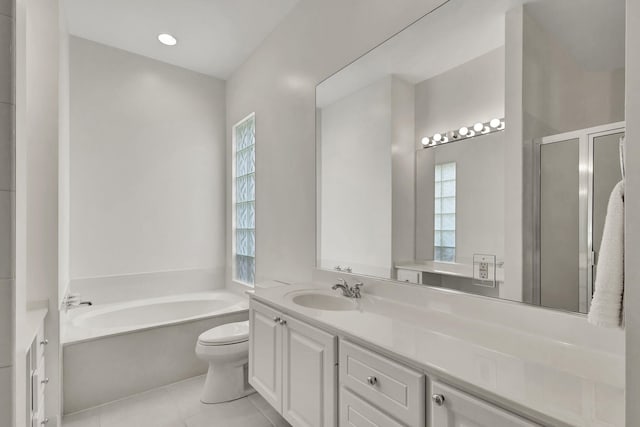 bathroom with vanity, a washtub, tile patterned flooring, and toilet