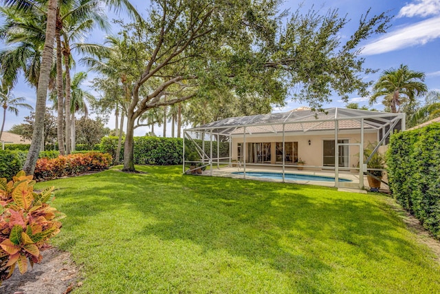 view of yard with a patio area and a lanai