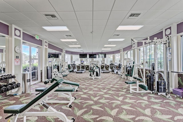 exercise room with carpet, french doors, and visible vents