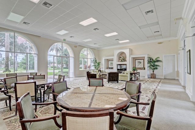 dining area featuring ornamental molding and visible vents