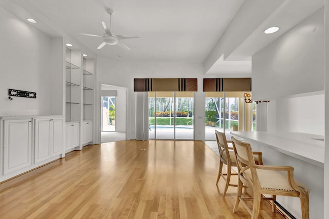 living room featuring light wood-type flooring and ceiling fan