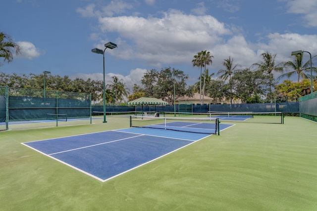 view of sport court with fence