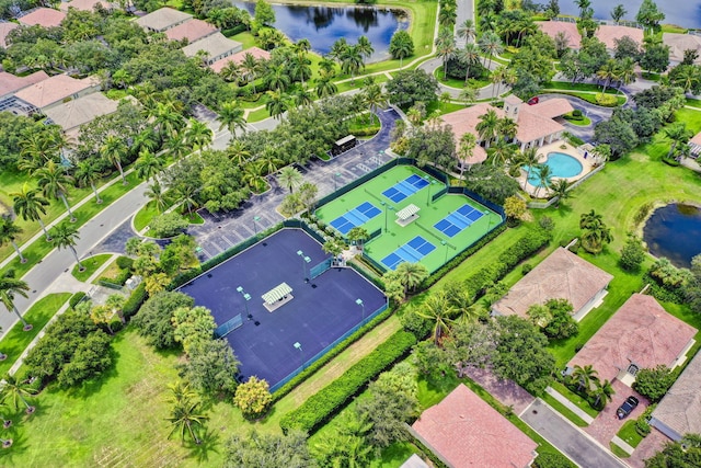 drone / aerial view with a water view and a residential view