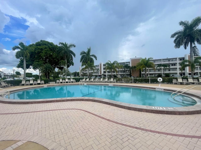 view of swimming pool featuring a patio